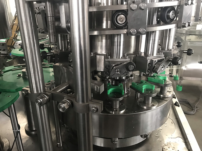 Máy tráng rửa, chiết rót và viền nắp yến hũ
